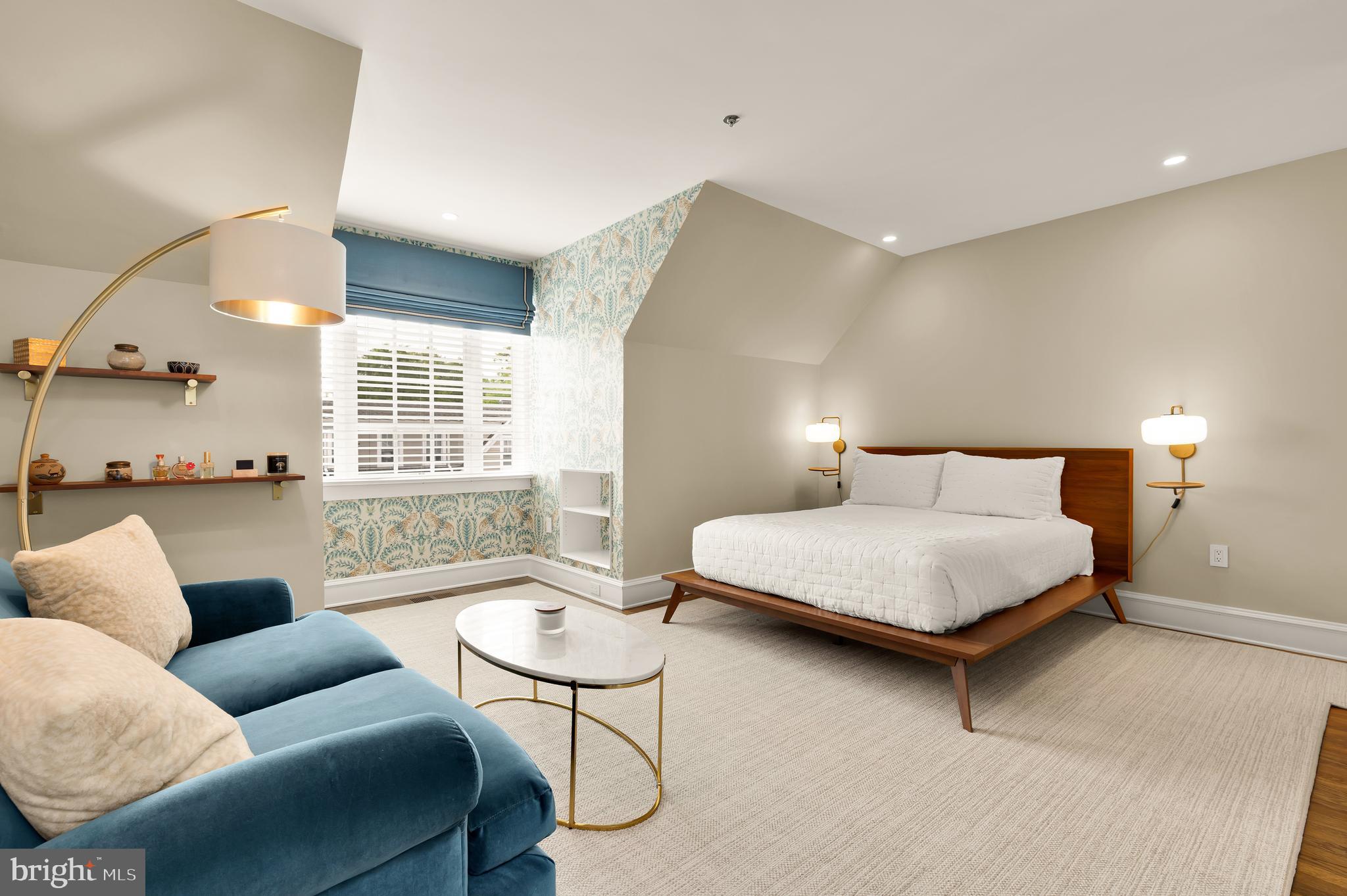 7449 Arlington Road Bethesda, MD 20814 - Photo 27 of 35 a bedroom with furniture and a large window