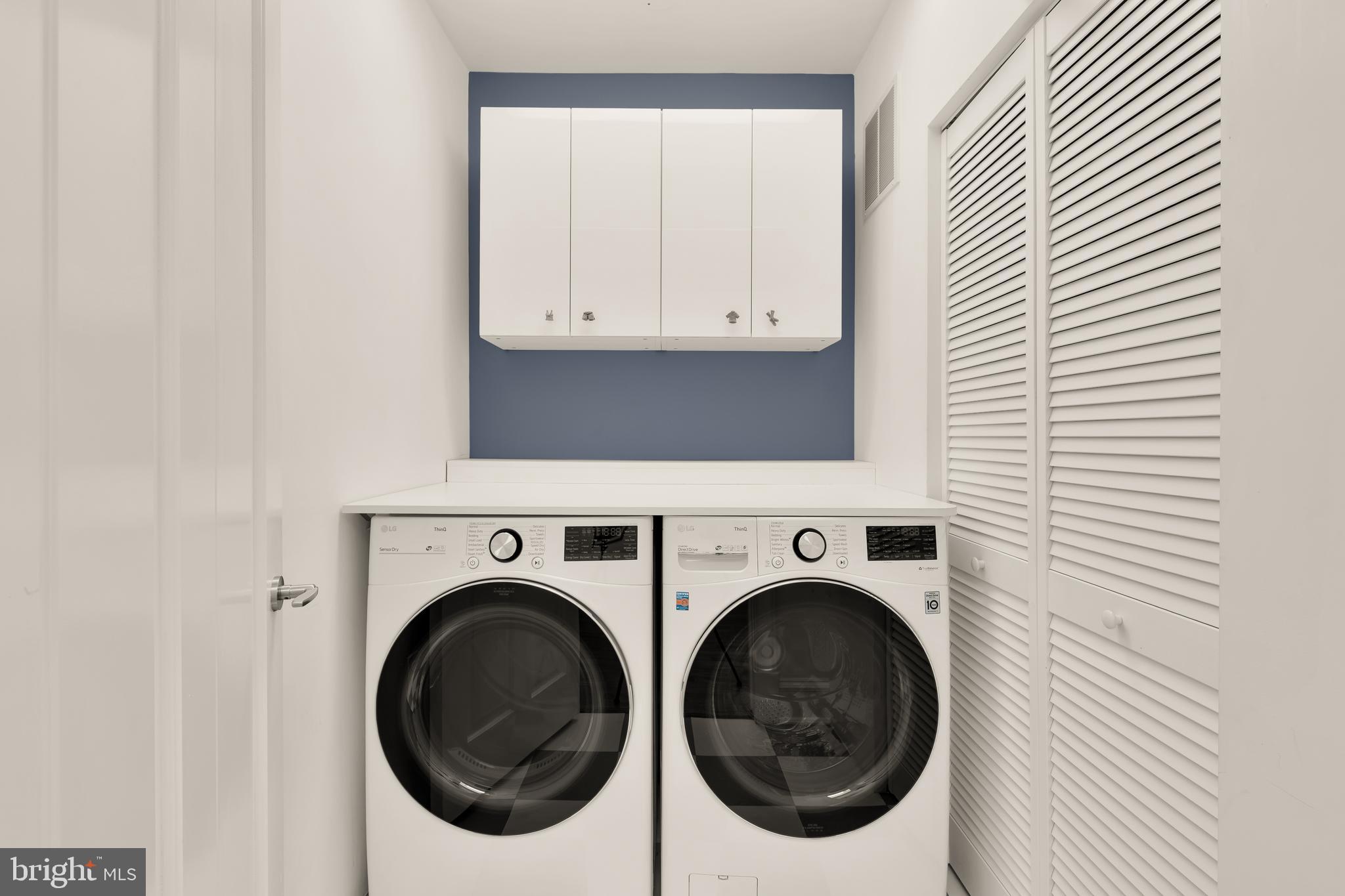 7449 Arlington Road Bethesda, MD 20814 - Photo 30 of 35 a utility room with dryer and washer