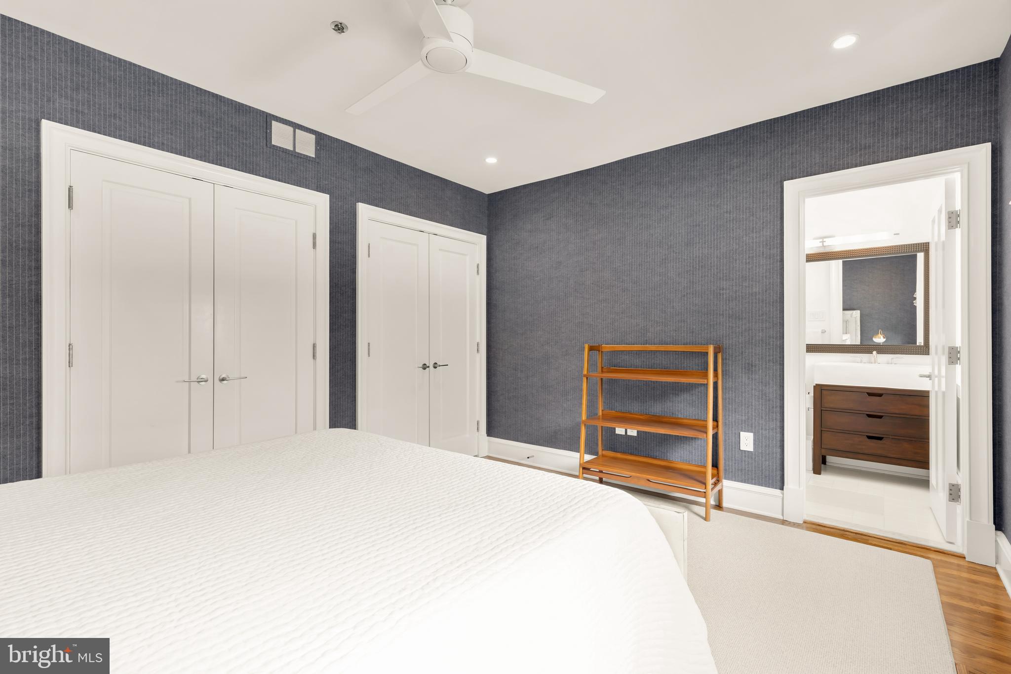 7449 Arlington Road Bethesda, MD 20814 - Photo 32 of 35 a bedroom with a bed and a dresser