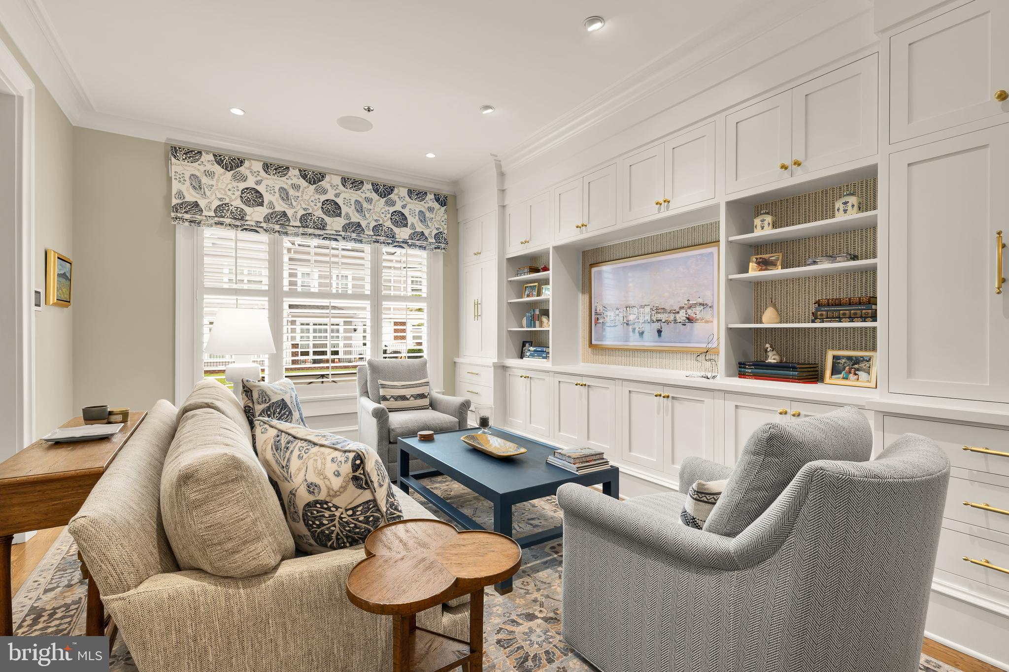 7449 Arlington Road Bethesda, MD 20814 - Photo 4 of 35 a living room with furniture and a large window