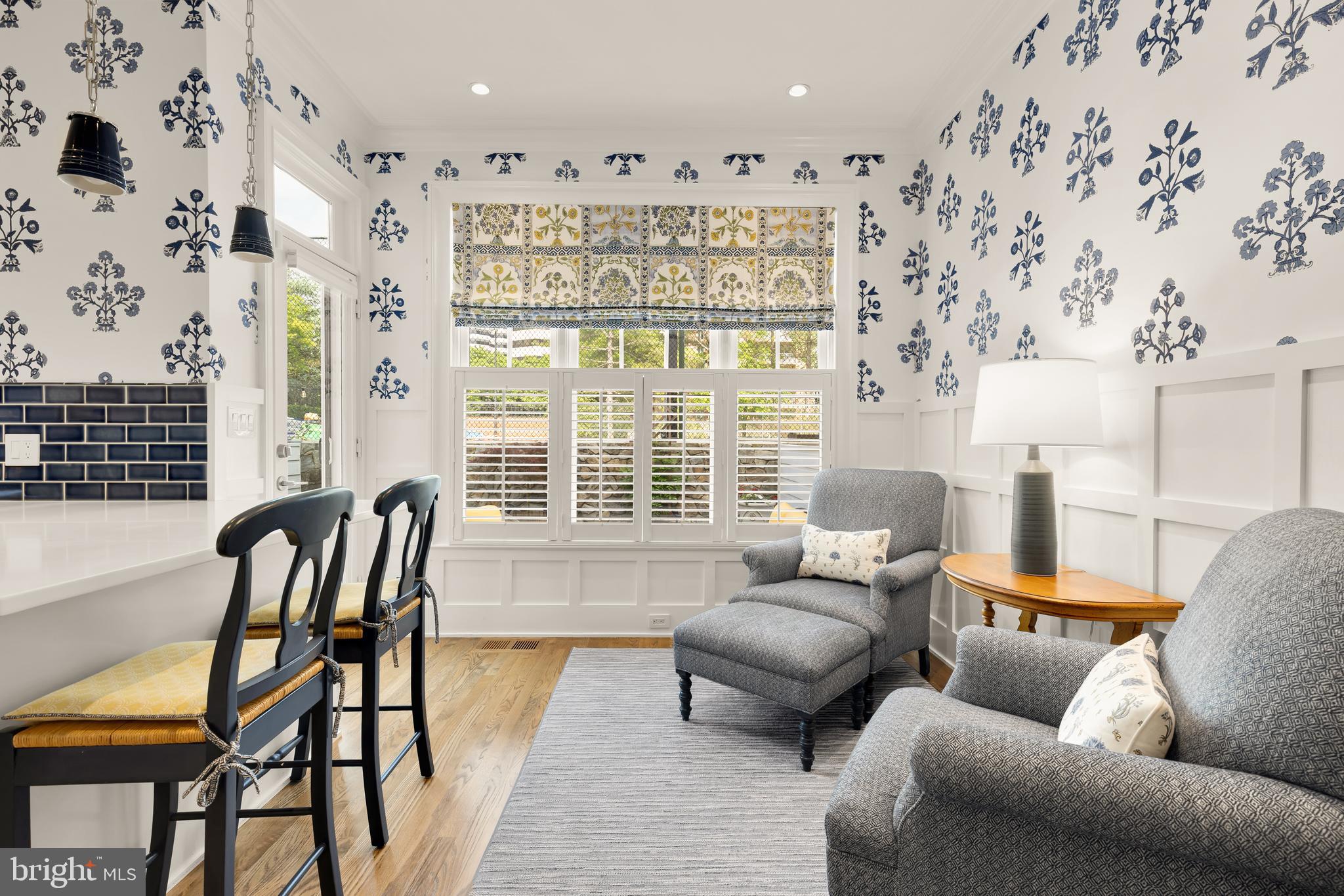 7449 Arlington Road Bethesda, MD 20814 - Photo 9 of 35 a living room with furniture and a floor to ceiling window
