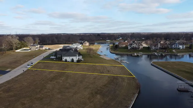 an aerial view of a house with a ocean view