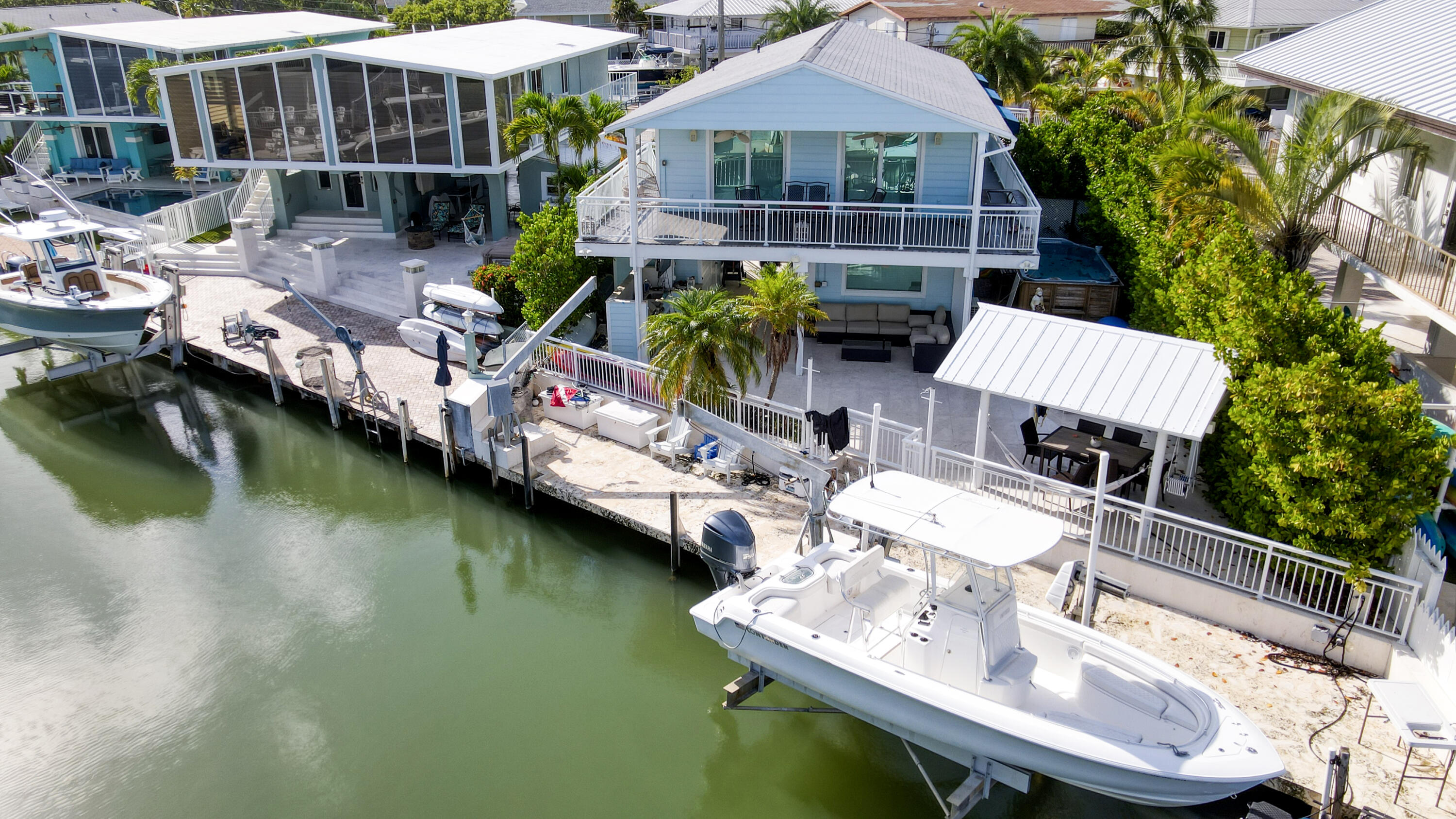 214 Aberdeen Court Tavernier, FL 33070 - Photo 1 of 81 a view of house with outdoor space and swimming pool