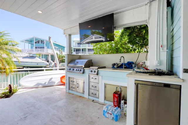 a view of a lake with a house swimming pool and outdoor space