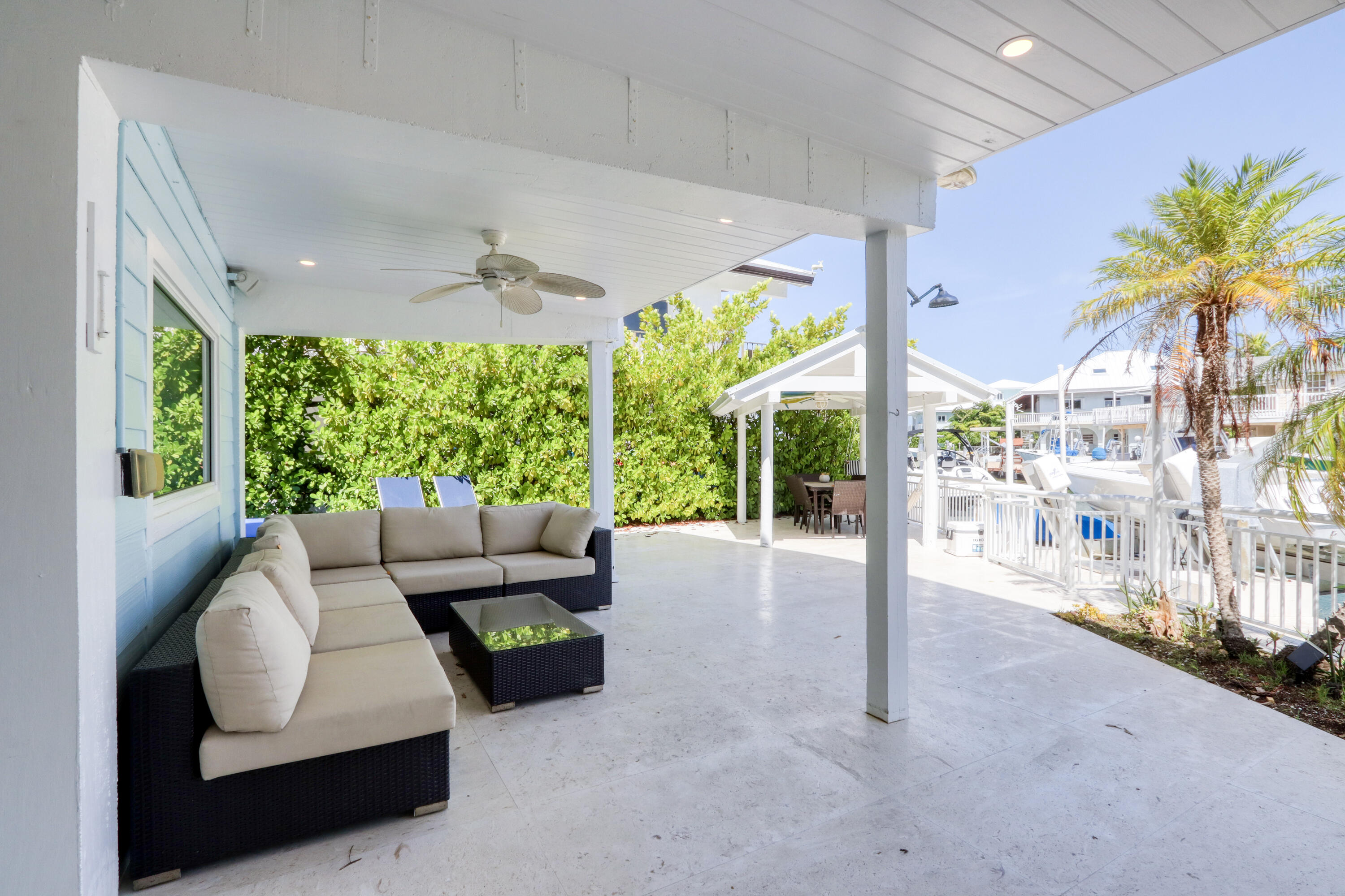 214 Aberdeen Court Tavernier, FL 33070 - Photo 13 of 81 a living room with furniture and a large window