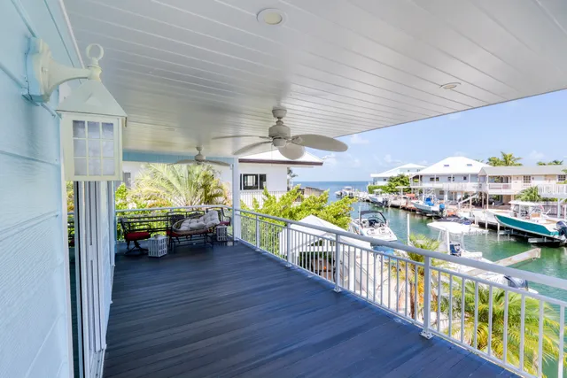 a bedroom with furniture and a large window