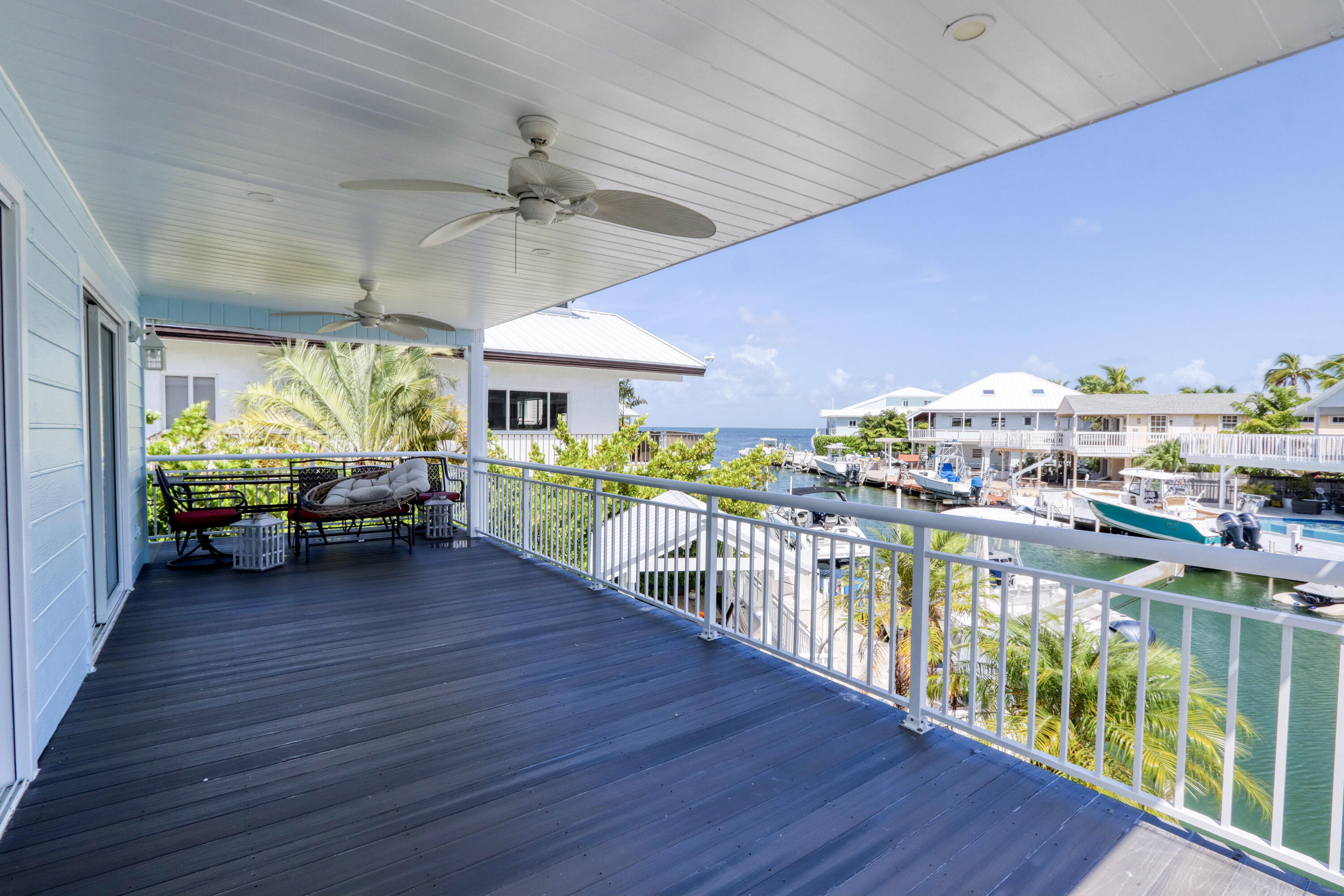 214 Aberdeen Court Tavernier, FL 33070 - Photo 16 of 81 a living room with furniture and a wooden floor
