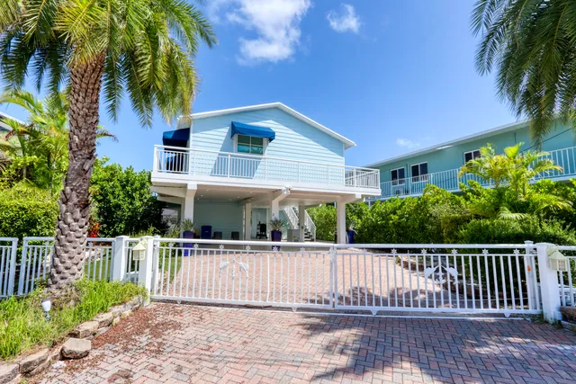 a view of a porch with wooden floor and a potted plant