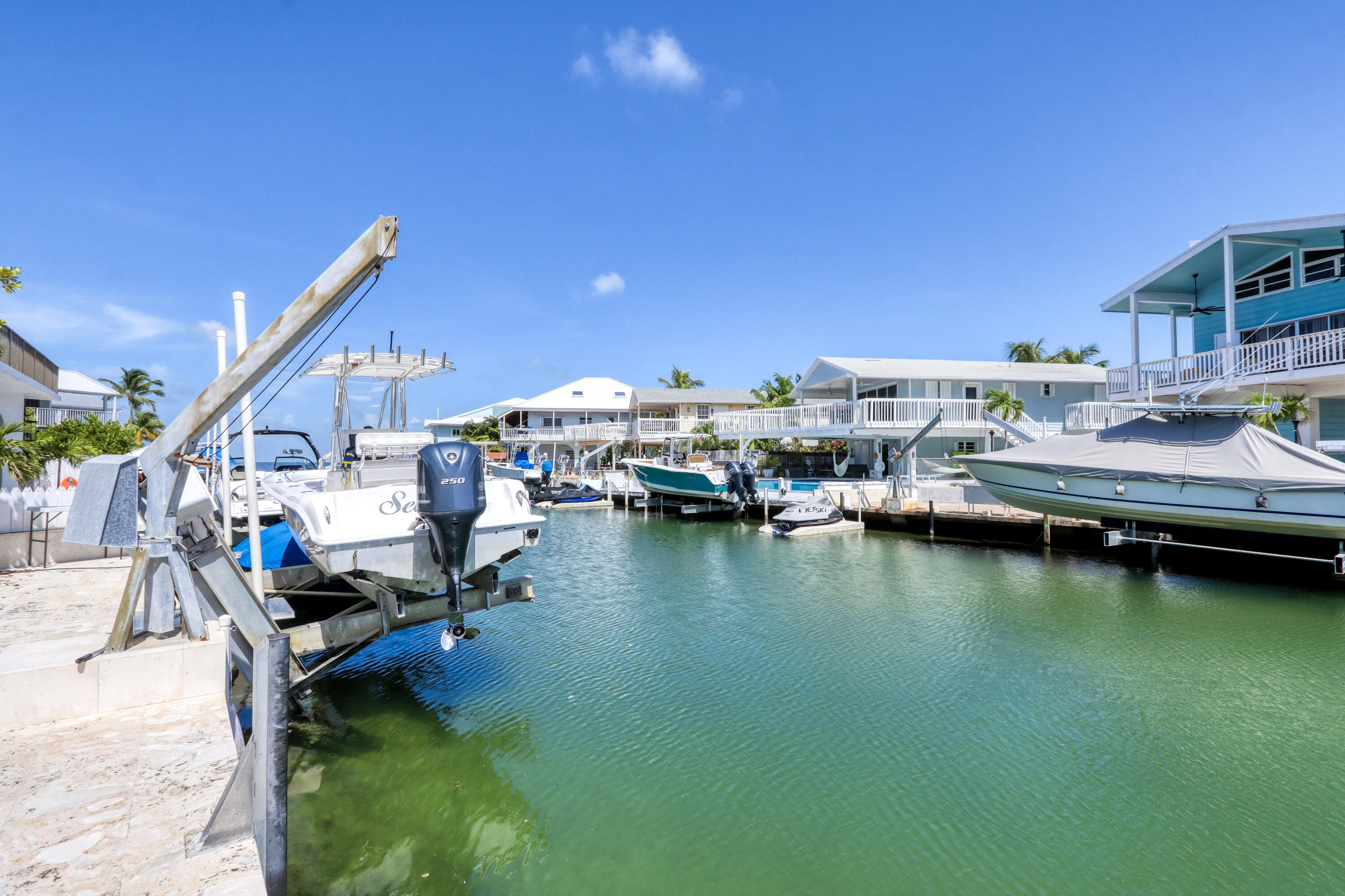 214 Aberdeen Court Tavernier, FL 33070 - Photo 22 of 81 a view of a lake with a house swimming pool and outdoor space