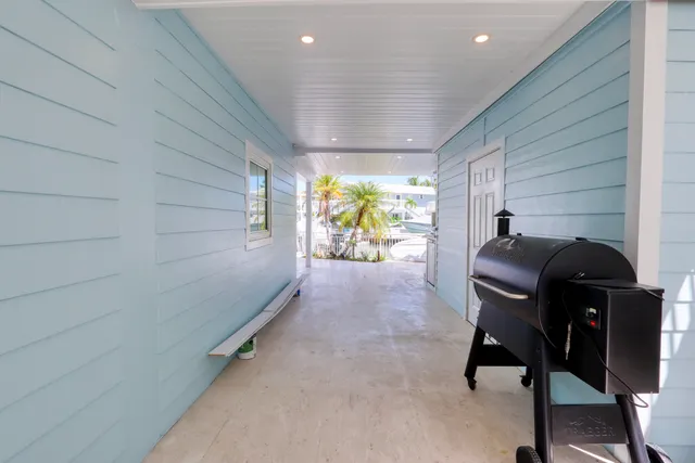 a kitchen with granite countertop a sink stainless steel appliances and cabinets
