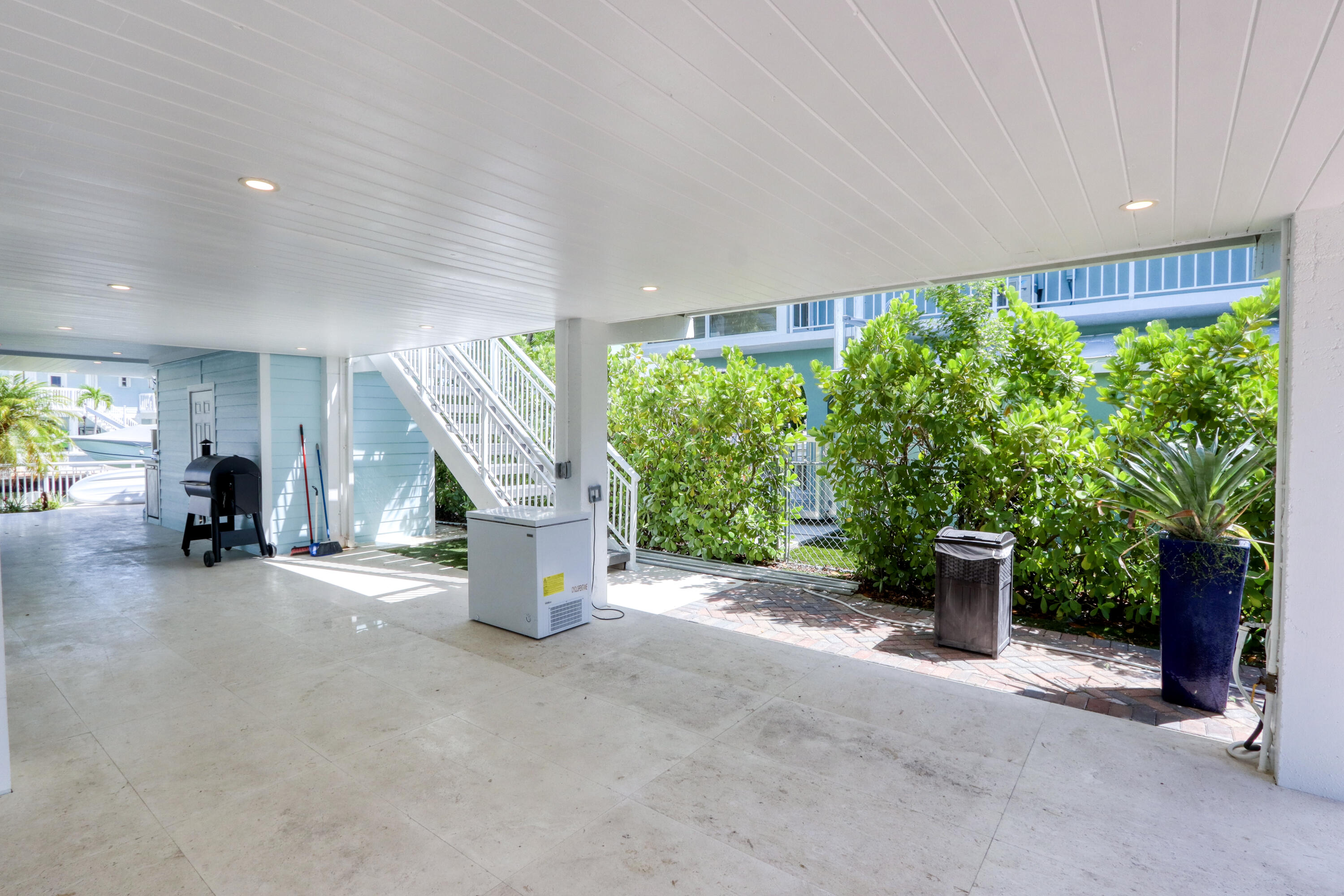 214 Aberdeen Court Tavernier, FL 33070 - Photo 32 of 81 a view of a porch with furniture and floor to ceiling window
