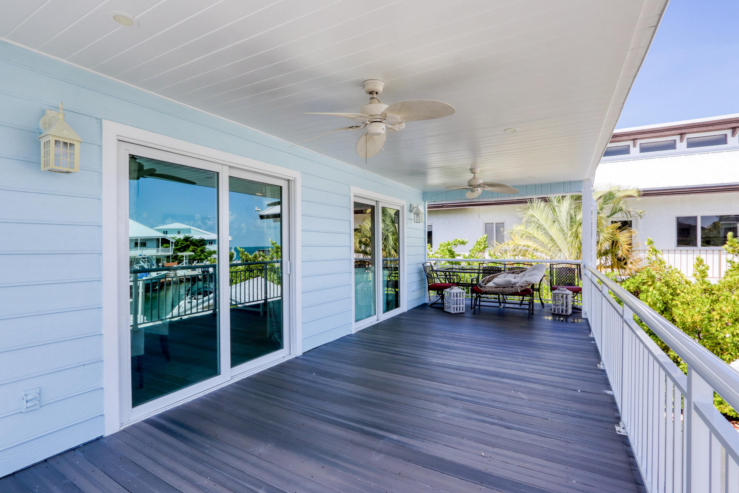214 Aberdeen Court Tavernier, FL 33070 - Photo 35 of 81 a view of a livingroom with hardwood floor and a ceiling fan