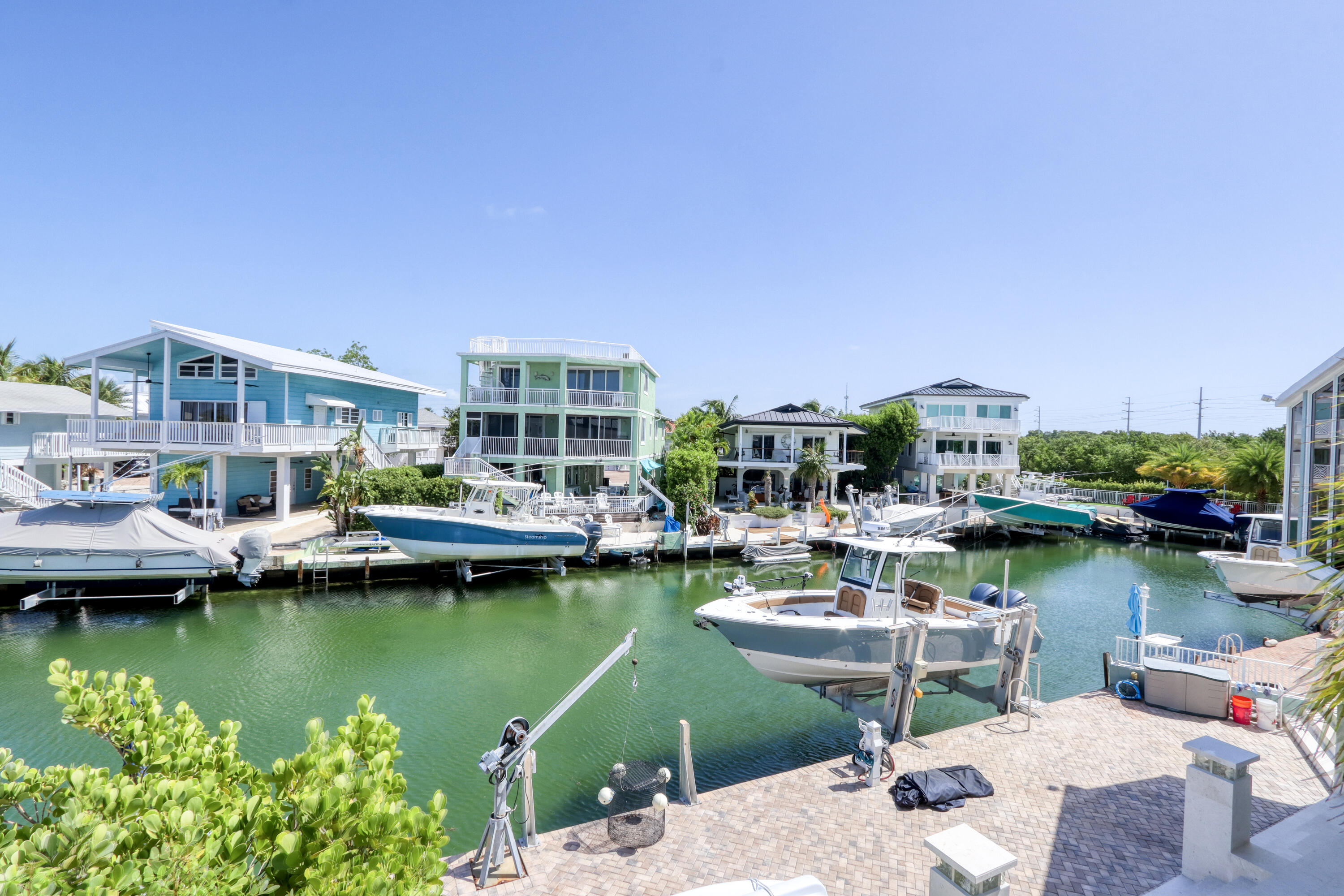 214 Aberdeen Court Tavernier, FL 33070 - Photo 38 of 81 a view of a lake with a house swimming pool and outdoor space