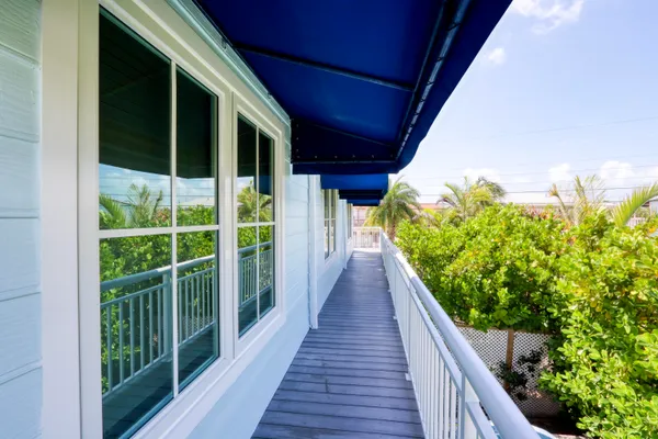 a living room with a bed furniture and a window