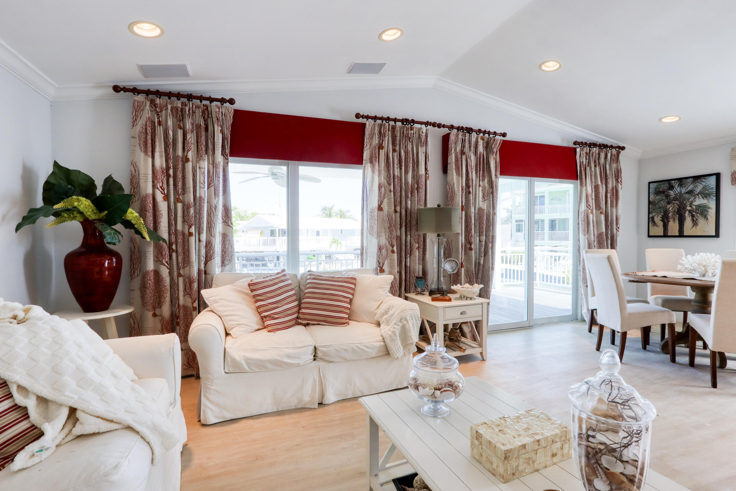 214 Aberdeen Court Tavernier, FL 33070 - Photo 44 of 81 a living room with furniture and large windows