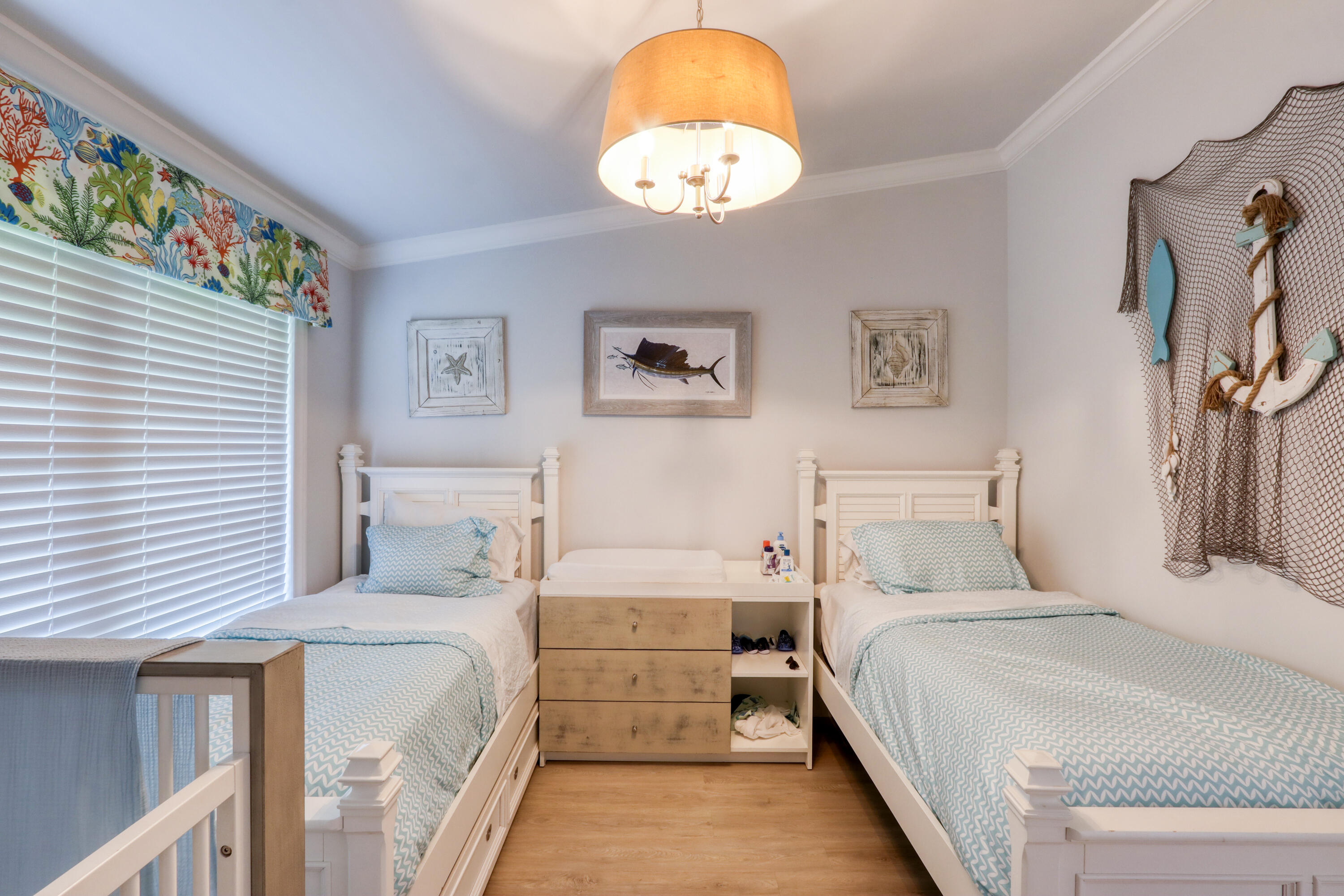 214 Aberdeen Court Tavernier, FL 33070 - Photo 58 of 81 a bedroom with a bed and a chandelier