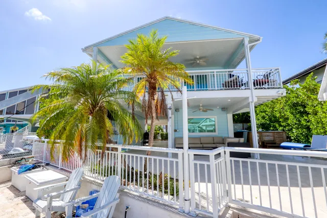 a aerial view of a house with swimming pool and outdoor space