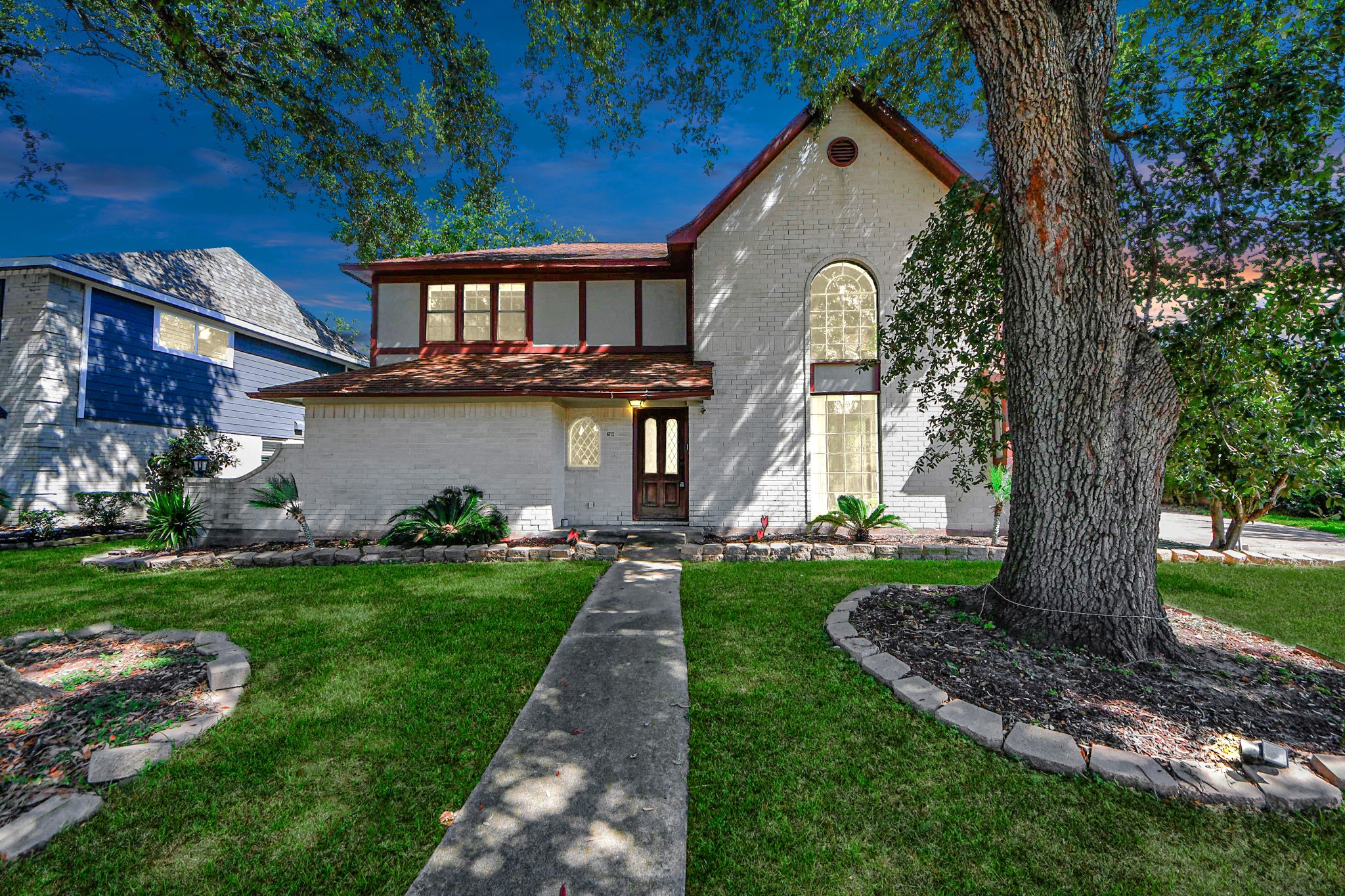4712 Country Club View Baytown, TX 77521 - Photo 1 of 50 a front view of a house with garden