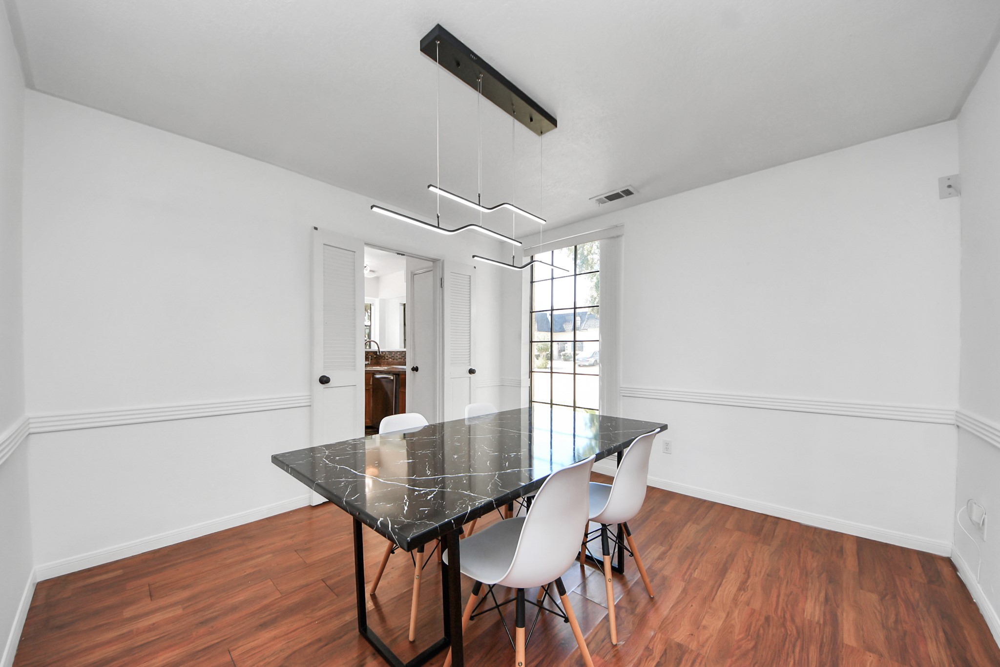 4712 Country Club View Baytown, TX 77521 - Photo 28 of 50 a view of a dining room with furniture and wooden floor
