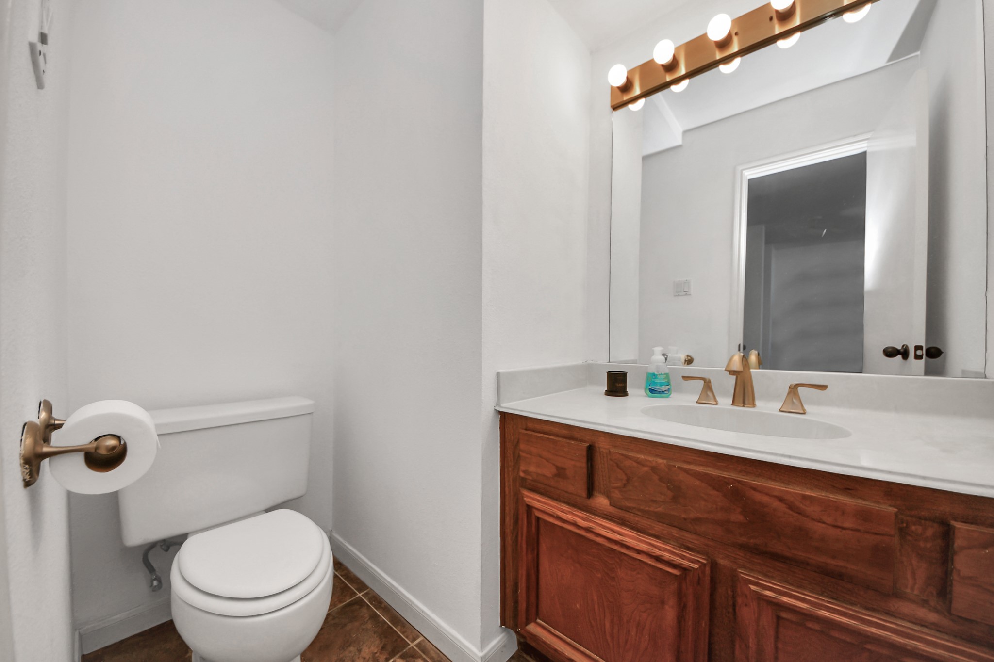 4712 Country Club View Baytown, TX 77521 - Photo 29 of 50 a bathroom with a granite countertop toilet sink and mirror
