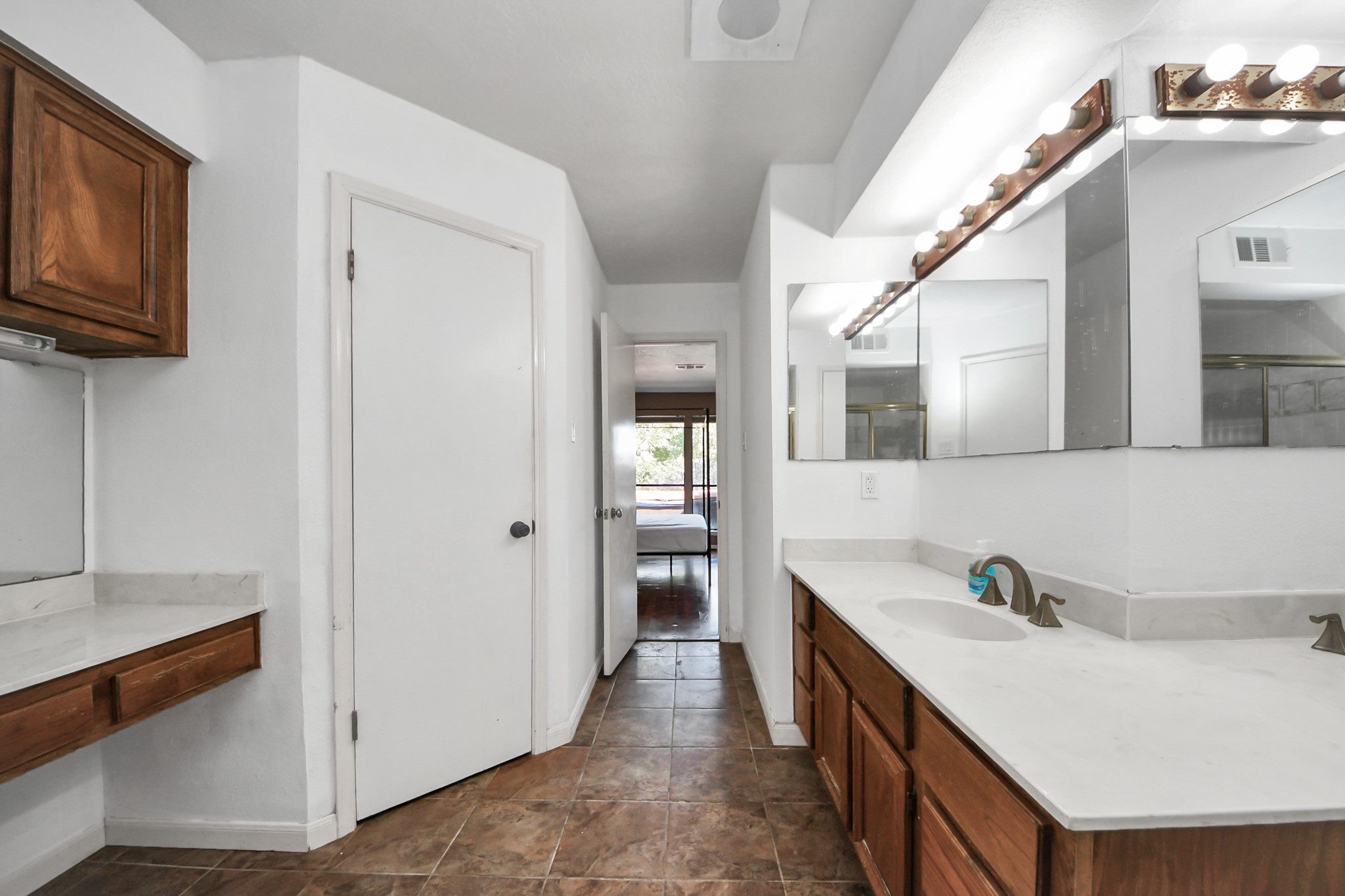 4712 Country Club View Baytown, TX 77521 - Photo 33 of 50 a spacious bathroom with a sink and a mirror