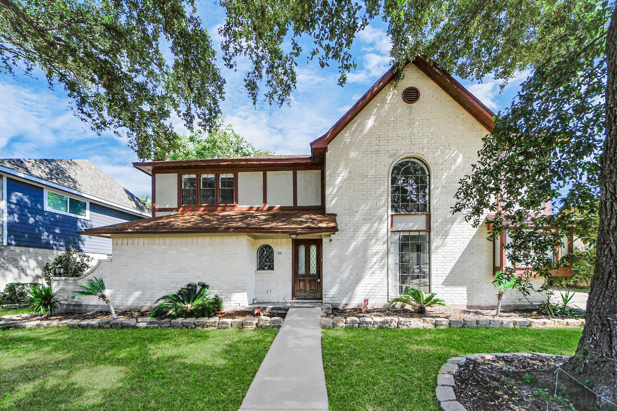 4712 Country Club View Baytown, TX 77521 - Photo 50 of 50 a front view of a house with a yard and potted plants
