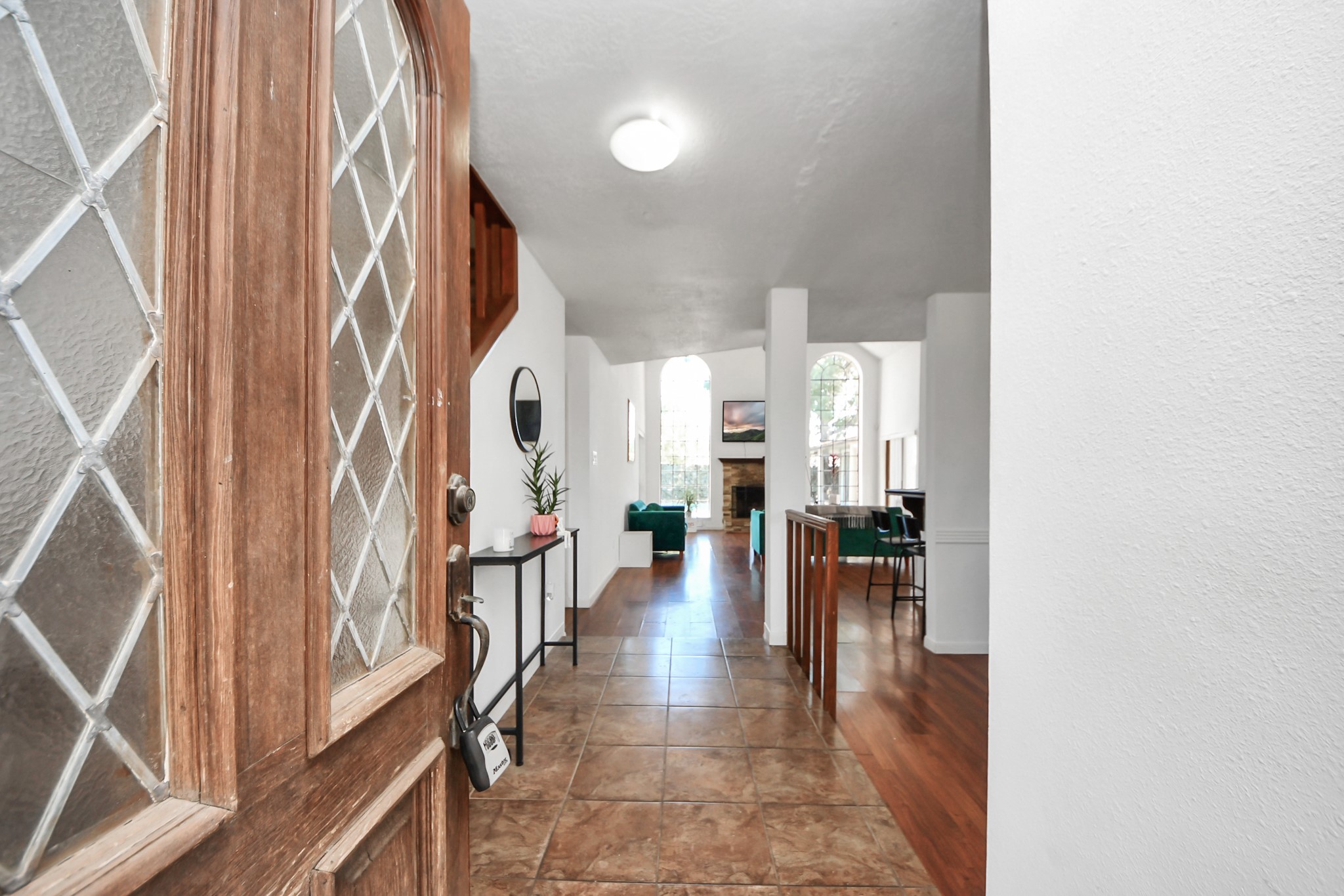 4712 Country Club View Baytown, TX 77521 - Photo 8 of 50 a view of a hallway with couches and dining table with chairs