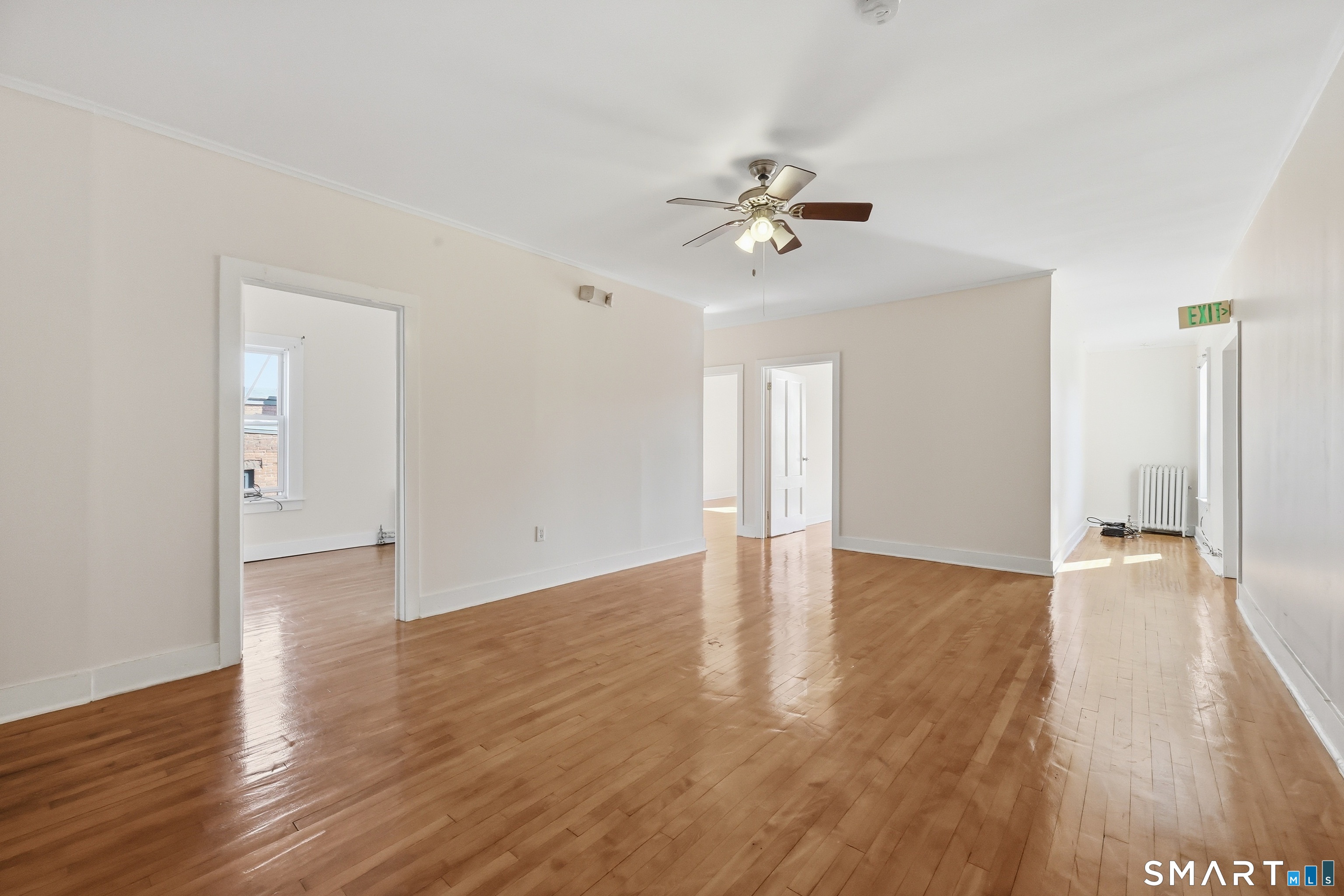 360 Main Street, Unit 3B Middletown, CT 06457 - Photo 3 of 21 a view of an empty room and wooden floor