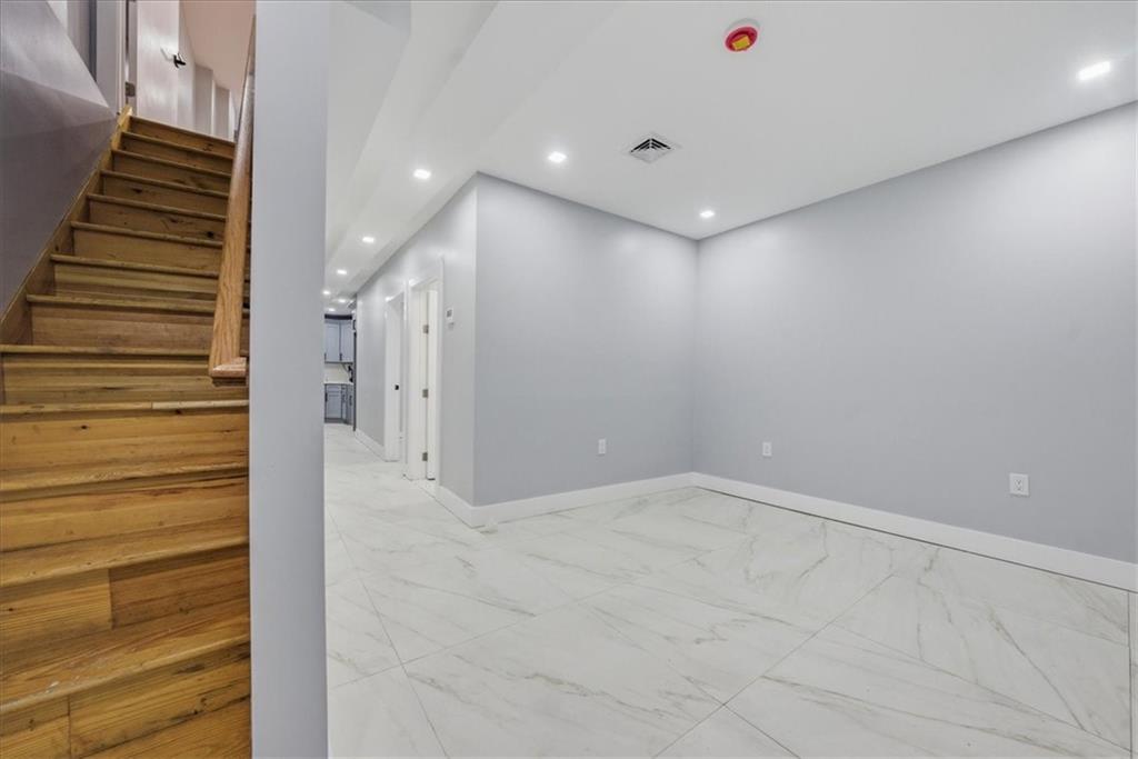 2862 Briggs Avenue Bronx, NY 10458 - Photo 15 of 38 a view of a hallway with stairs
