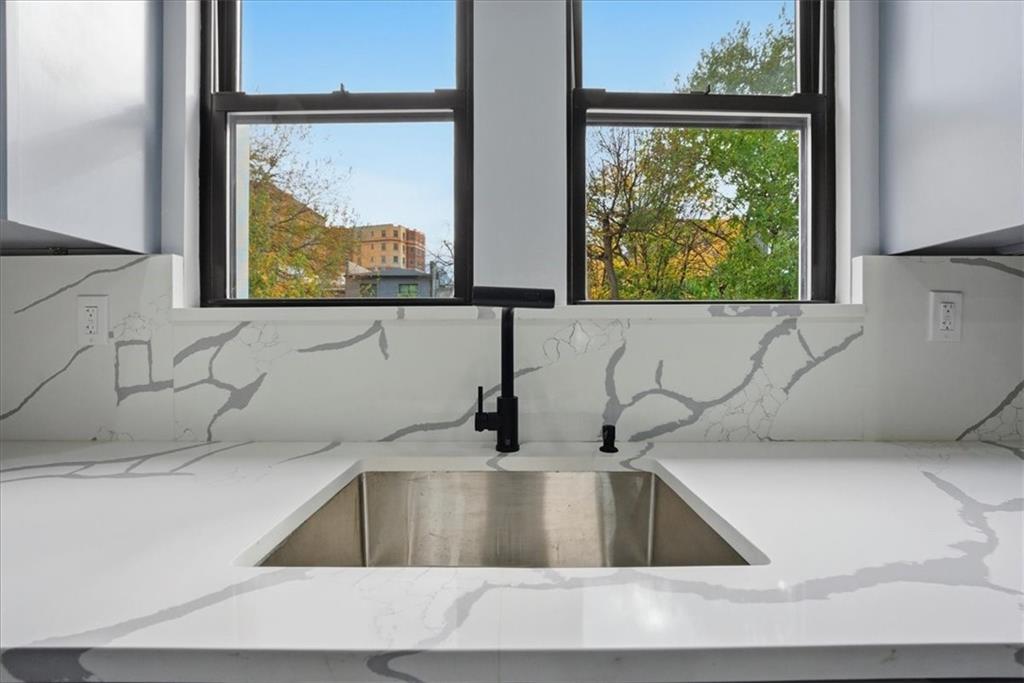 2862 Briggs Avenue Bronx, NY 10458 - Photo 20 of 38 a kitchen with a sink and a large window