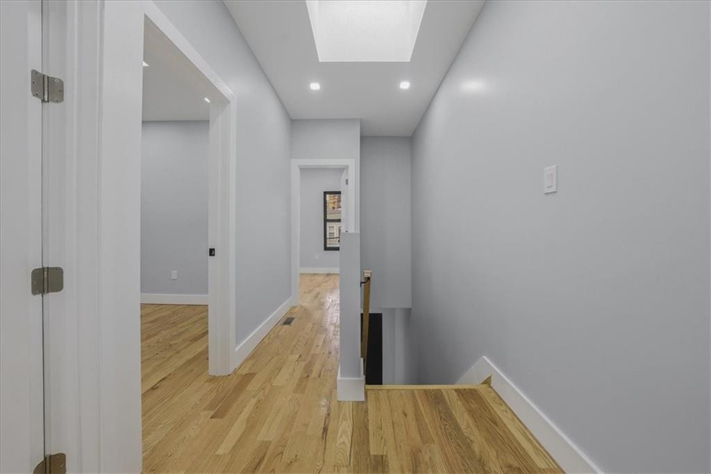 2862 Briggs Avenue Bronx, NY 10458 - Photo 21 of 38 a view of a hallway with wooden floor