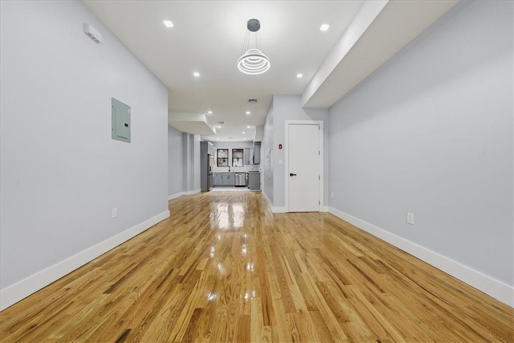 2862 Briggs Avenue Bronx, NY 10458 - Photo 27 of 38 a view of empty room with wooden floor