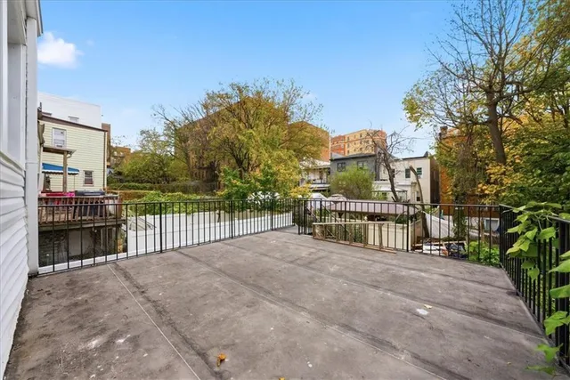 a view of a wrought iron fences in front of house