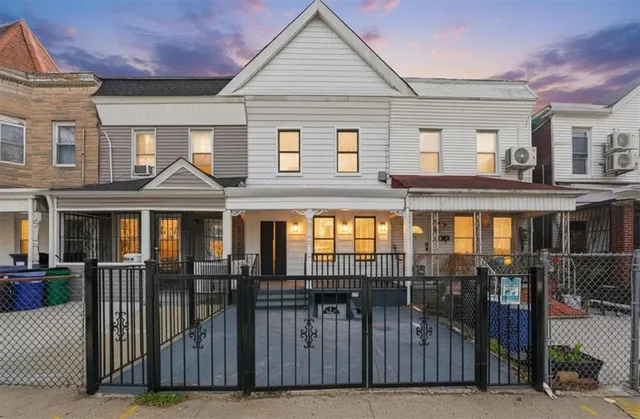 a front view of a house with glass windows