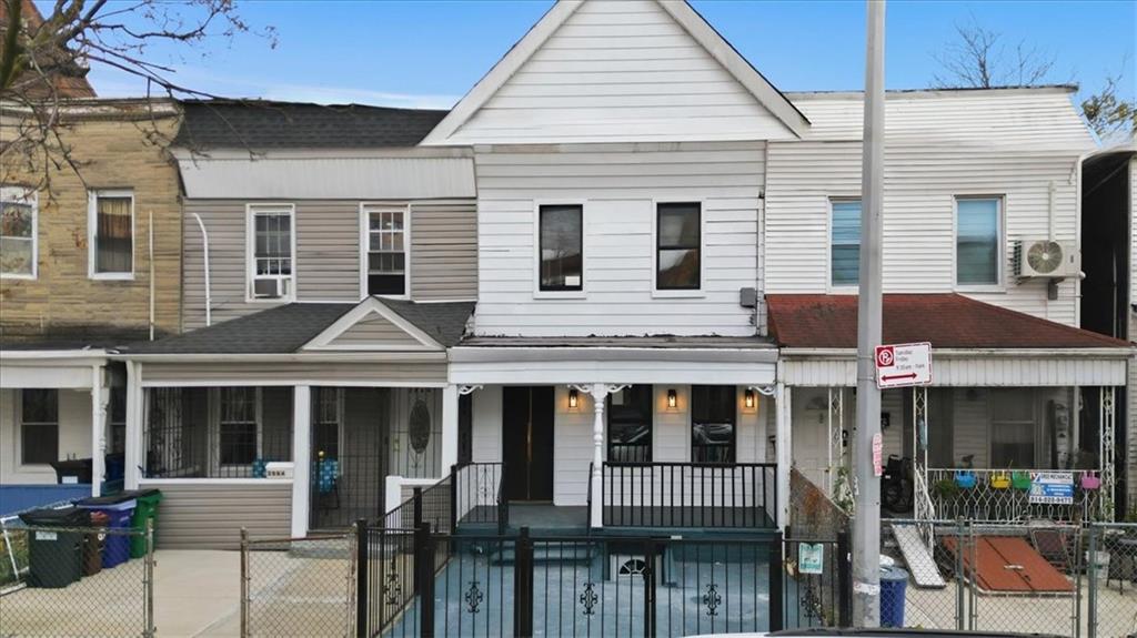 2862 Briggs Avenue Bronx, NY 10458 - Photo 6 of 38 a front view of a house with a yard