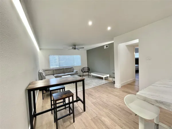 a workspace with furniture and wooden floor