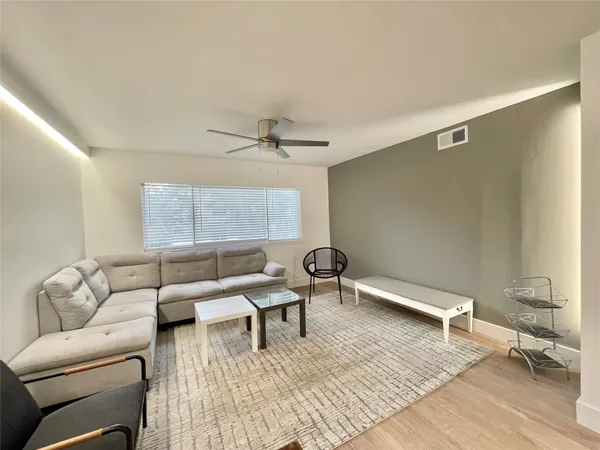a living room with furniture and a window