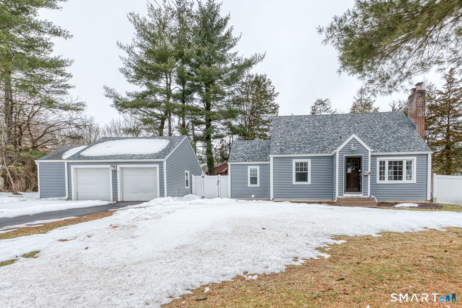 11 Charter Road Wethersfield, CT 06109 - Photo 1 of 40 a front view of a house with a yard covered in snow