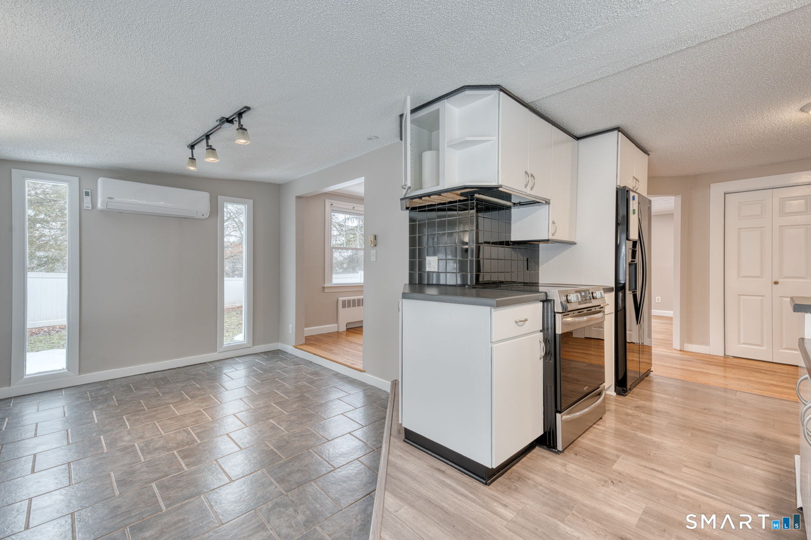 11 Charter Road Wethersfield, CT 06109 - Photo 13 of 40 a kitchen with granite countertop a refrigerator and a stove top oven