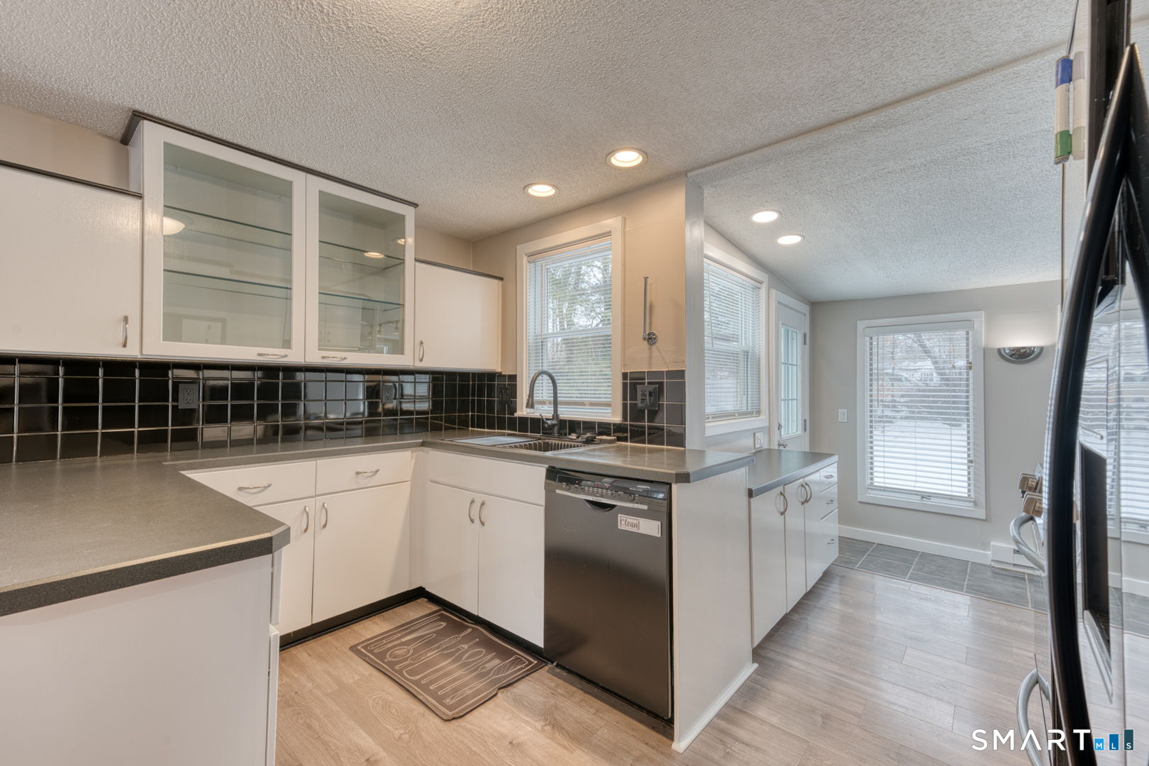 11 Charter Road Wethersfield, CT 06109 - Photo 17 of 40 a kitchen with stainless steel appliances granite countertop a stove a sink and a refrigerator