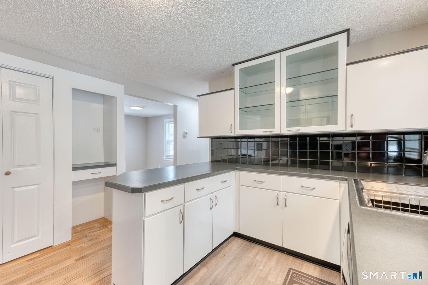 11 Charter Road Wethersfield, CT 06109 - Photo 18 of 40 a kitchen with stainless steel appliances double vanity and a granite counter tops