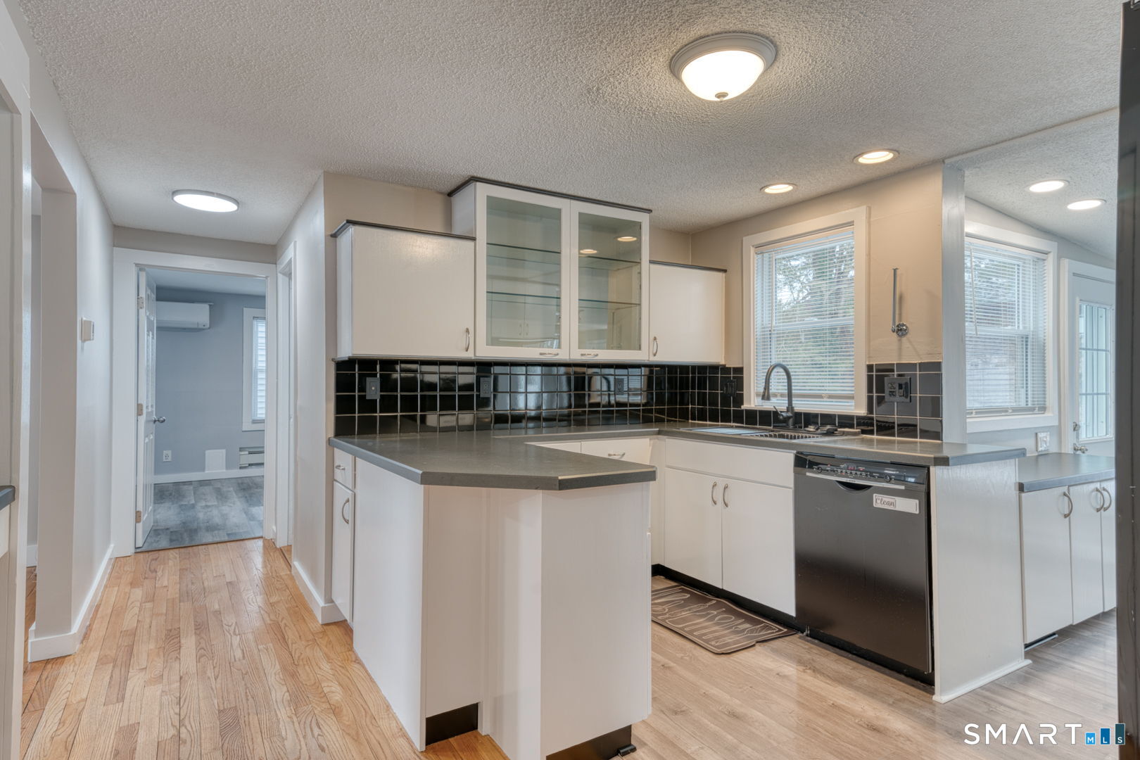 11 Charter Road Wethersfield, CT 06109 - Photo 19 of 40 a kitchen with stainless steel appliances granite countertop a stove and cabinets