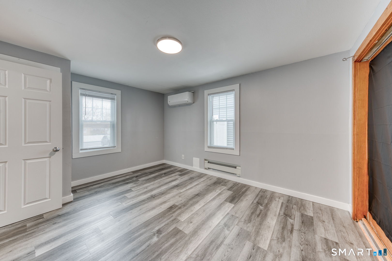 11 Charter Road Wethersfield, CT 06109 - Photo 25 of 40 a view of empty room with wooden floor and fan