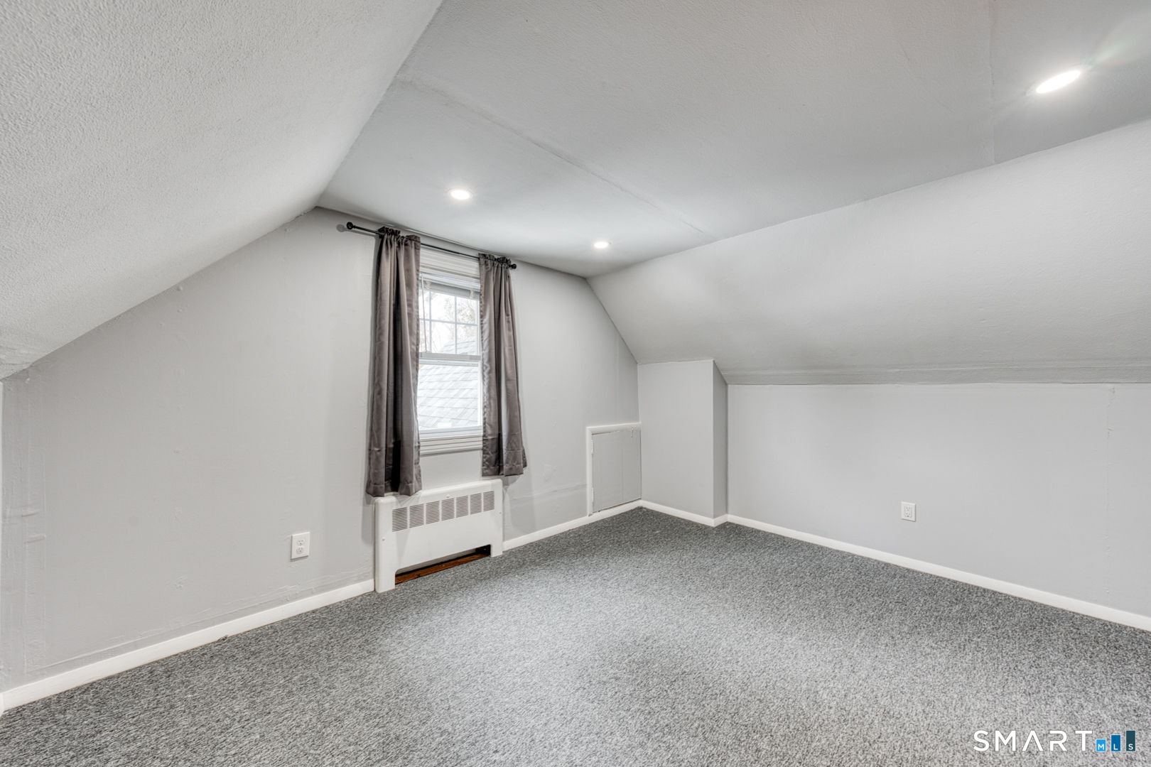 11 Charter Road Wethersfield, CT 06109 - Photo 30 of 40 an empty room with a fireplace and windows
