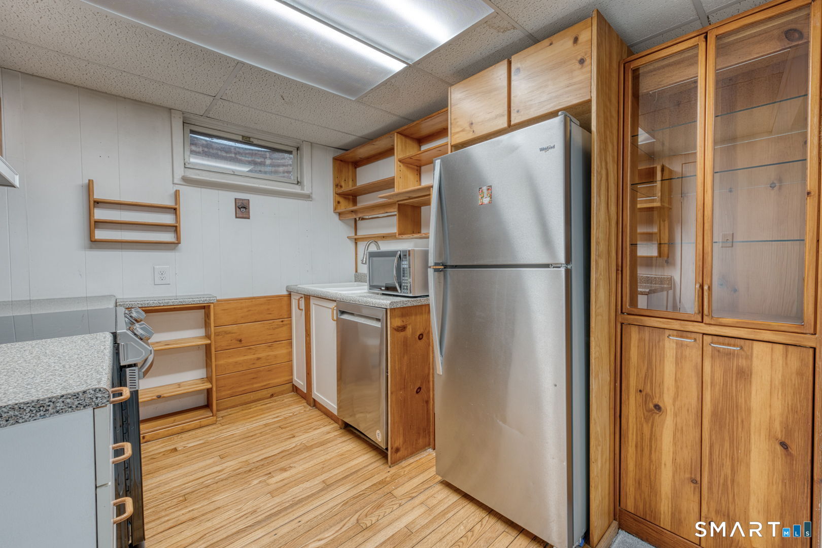 11 Charter Road Wethersfield, CT 06109 - Photo 34 of 40 a white refrigerator freezer and a wooden floor