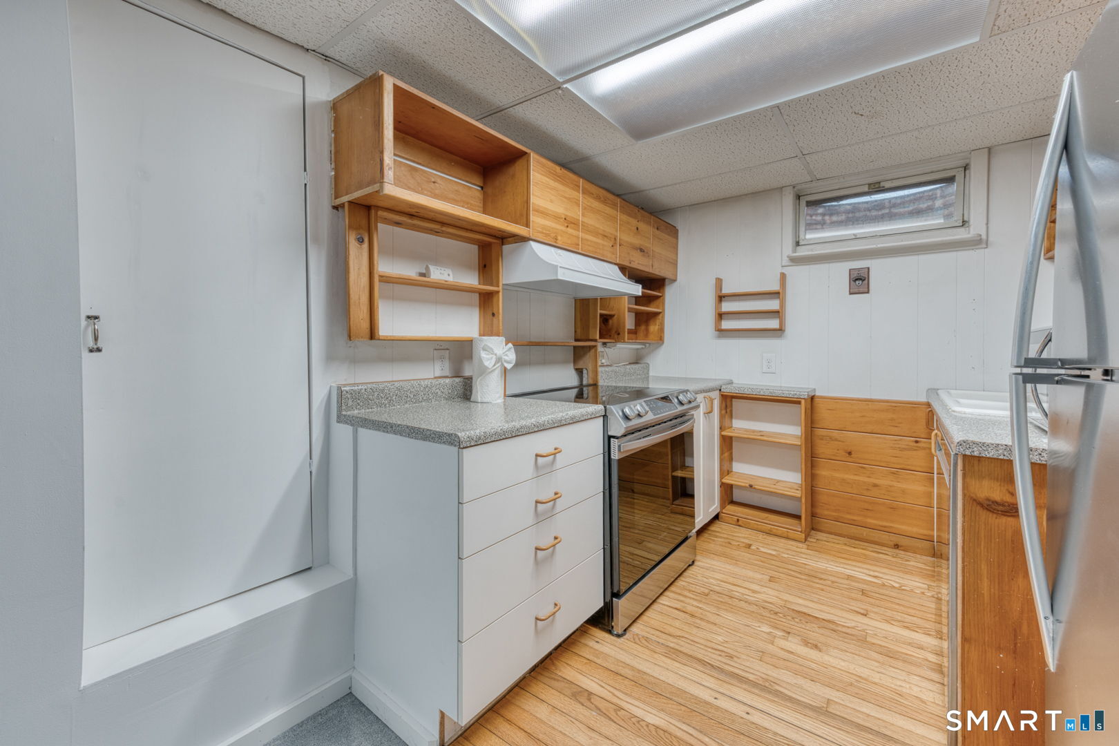 11 Charter Road Wethersfield, CT 06109 - Photo 35 of 40 a kitchen with cabinets and wooden floor