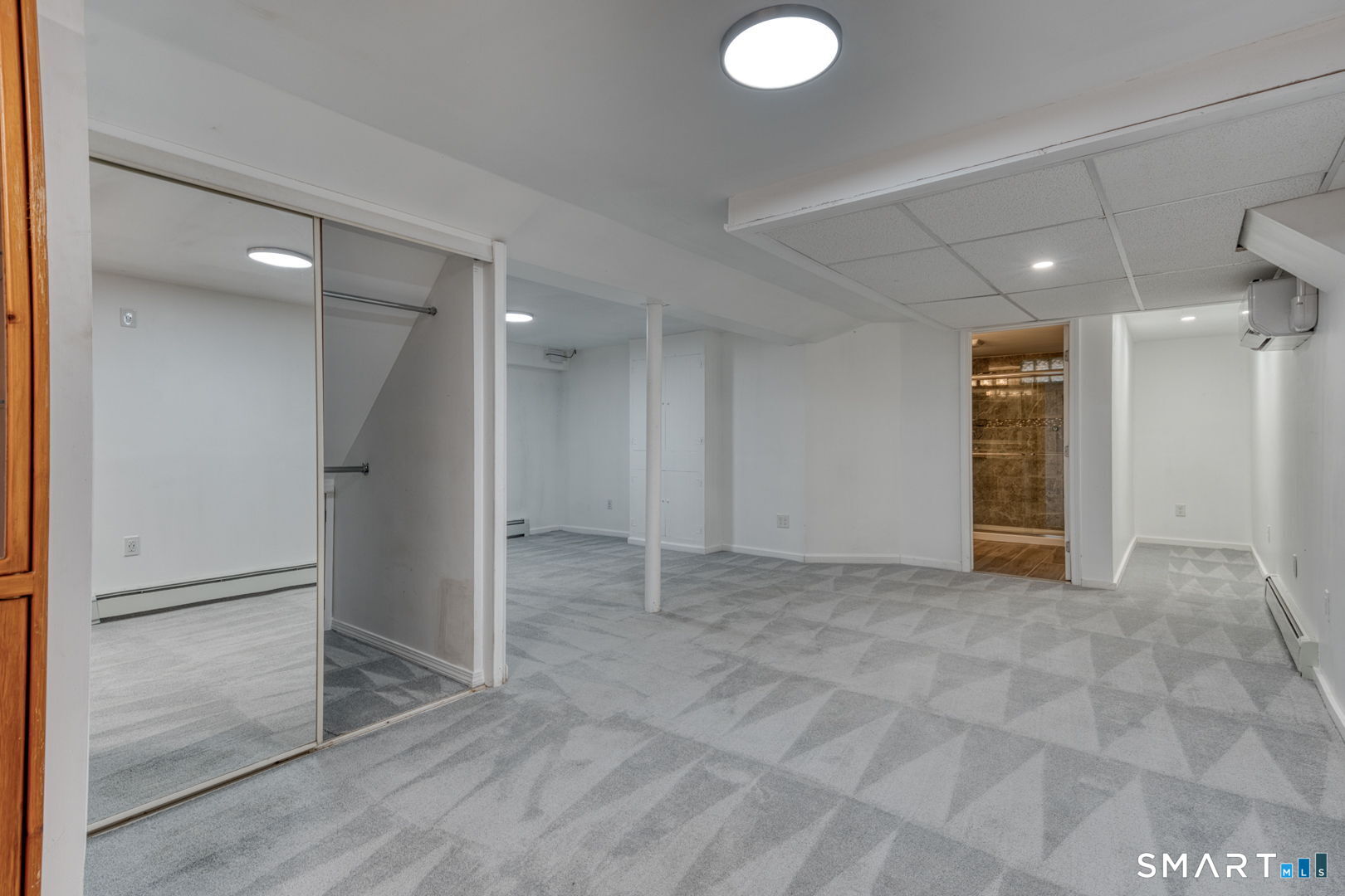 11 Charter Road Wethersfield, CT 06109 - Photo 36 of 40 an empty room with wooden floor and windows