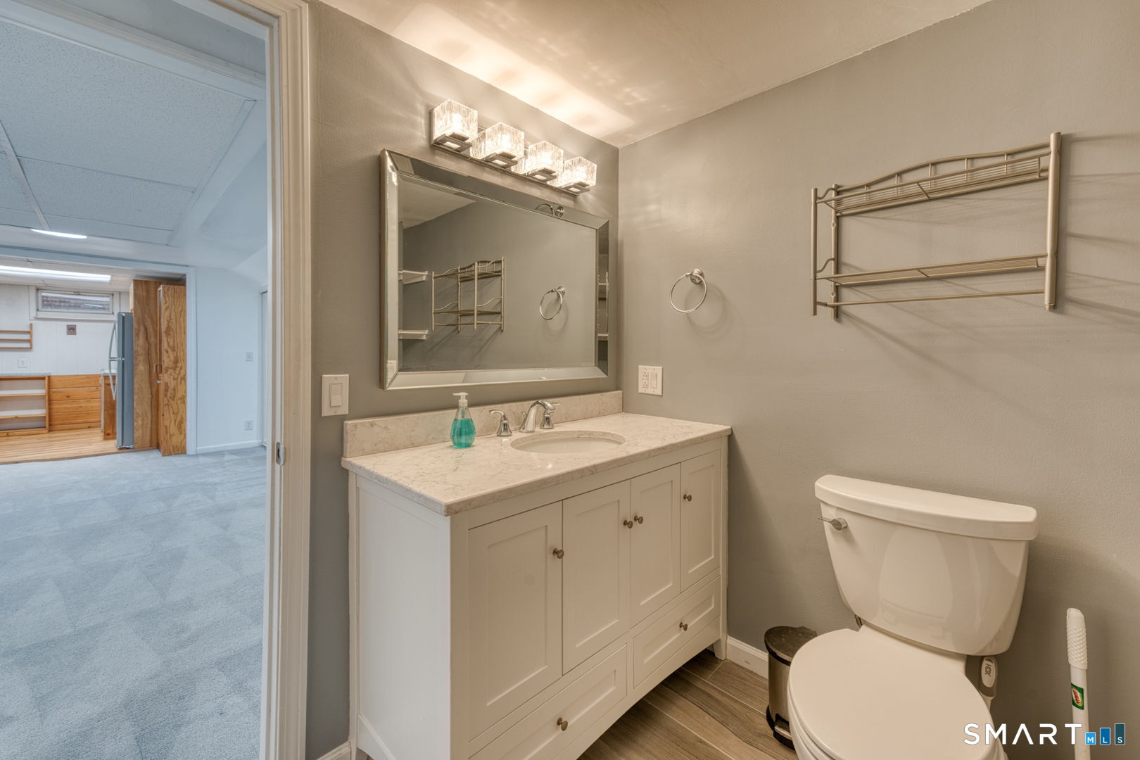 11 Charter Road Wethersfield, CT 06109 - Photo 37 of 40 a bathroom with a toilet a sink and mirror