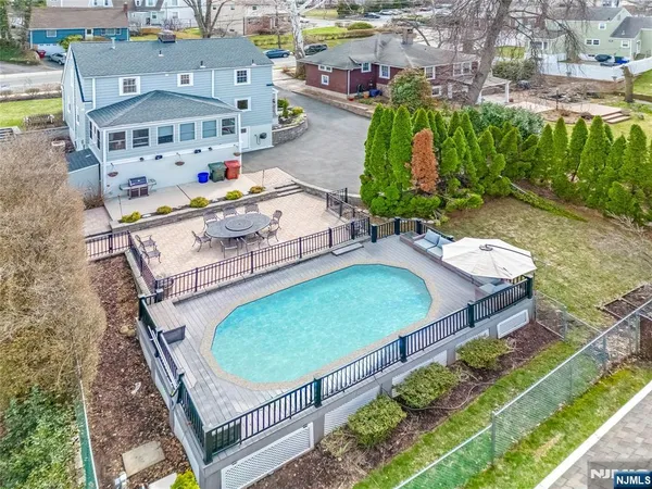 a living room with a bed dresser and a window