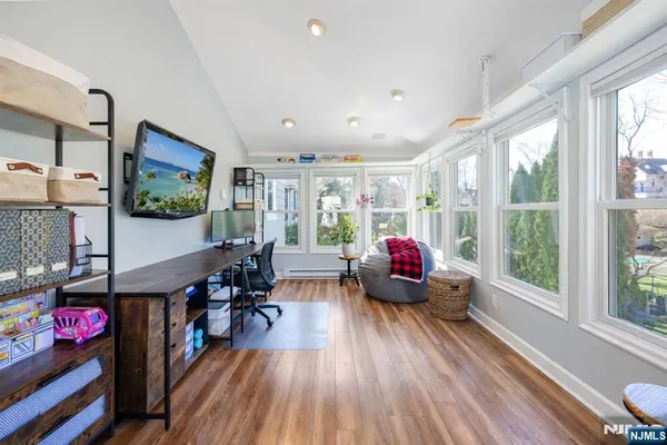 a living room with fireplace furniture and a flat screen tv